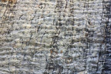 stone or rock wave texture gray and yellow wall on mountain cliff for background or wallpaper