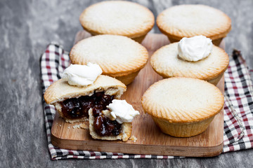 Mince  pie group on cutting board on wooden background