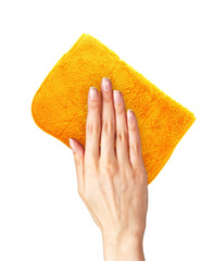 Hand wiping surface with orange rag isolated on white
