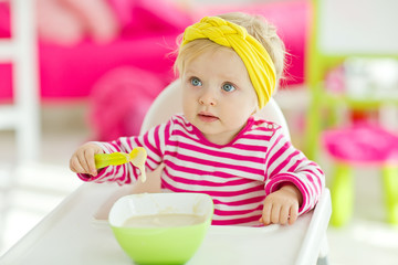 The baby eats 