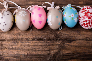 easter eggs on rustic wooden background