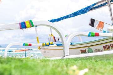 Colorful boats on the beach of tropical Bali island, Indonesia.