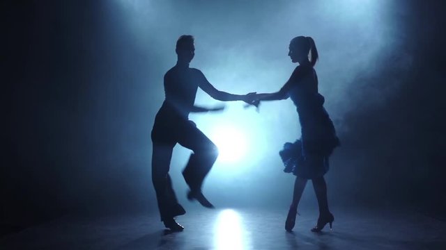 Dance latina performed by a professional couple in slow motion