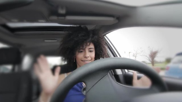 Female driver inside autonomous car