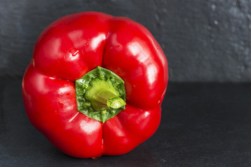 red sweet pepper on a slate close up
