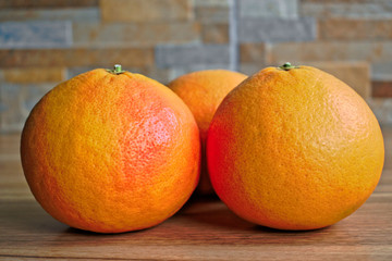 Closeup of grapefruits on a wooden table
