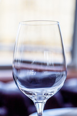 Empty wine glass or water is on the table.