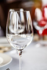 Empty wine glass or water is on the table.