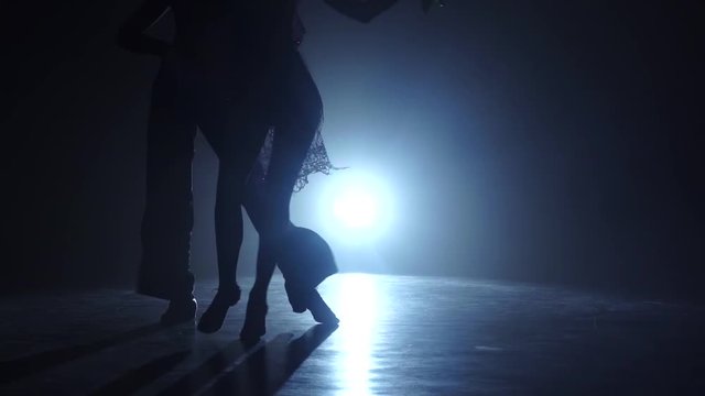 Dance couple demonstrating magnificent choreography of latino, slow motion. Close-ups