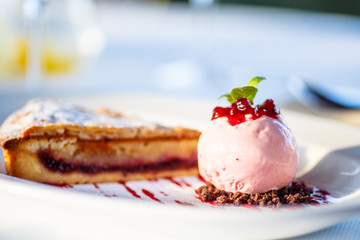 A ball of pink ice cream pie dessert.