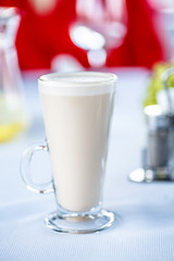 Coffee with milk, or Raw coffee in a tall glass.