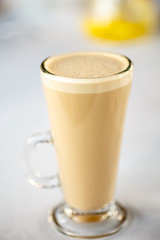 Coffee with milk, or Raw coffee in a tall glass.