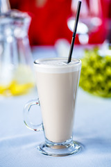 Coffee with milk, or Raw coffee in a tall glass.
