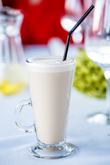 Coffee with milk, or Raw coffee in a tall glass.