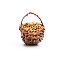 Fototapeta na wymiar Flax seeds in small basket on white background