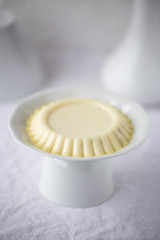 Panna Cotta with with chocolate on light background. North Italian dessert from cream, sugar and vanilla.