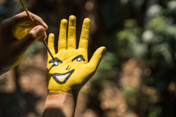 Children are drawing their own hands.