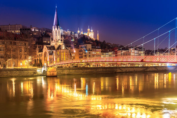 Fototapeta na wymiar View of Saone river, Famous church in Lyon city at evening