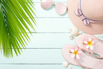 beach accessories and palm leaf