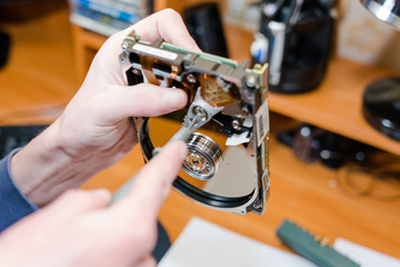 To disassemble a hard drive.