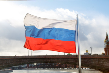 Russian flag on the background of the Moscow Kremlin