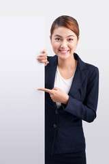 Young attractive asian woman showing a white board