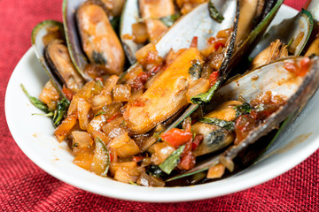 Mussel with white wine sauce on table