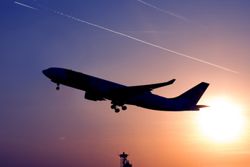 airplane taking in backlight