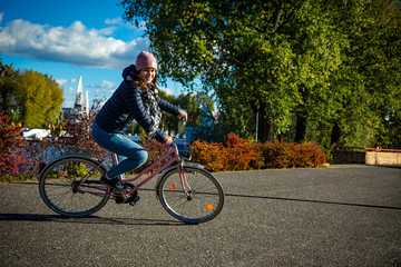 Girl biking in city 