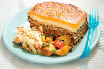 Lasagne with potato salad and coleslaw