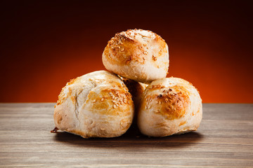 Pastry - crispy buns on wooden table
