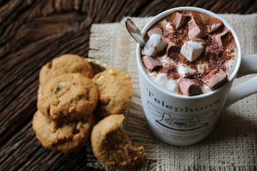 Hot cocoa Marshmallow cookies on dark wood background with copy space