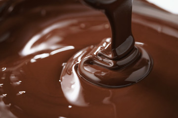 macro photo of premium dark chocolate pour in bowl, shallow focus