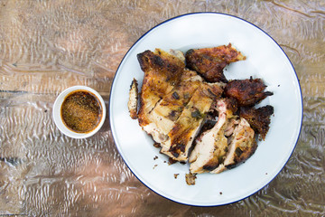 Grilled chicken on wooden background
