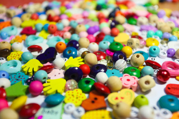 Fototapeta na wymiar Beads Background. Retro Top View Colorful Bead Heap. child background.
