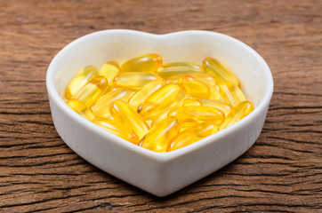 fish oil in heart shape bowl