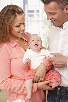 Happy family with smiling baby