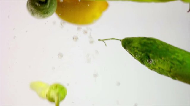 Vegetables falling into water