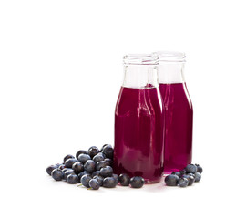 Blueberry  juice in glass bottles © lena_zajchikova