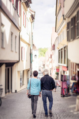 Fototapeta na wymiar Senior Couple Walking Through The Streets Of T�bingen, Germany
