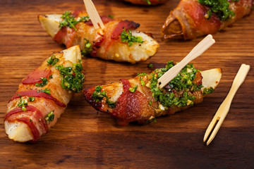 Bacon Wrapped Potatoes with Parsley Garlic Pesto Sauce. Selective focus.