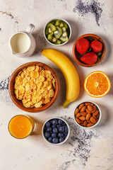 Healthy breakfast - bowl of corn flakes, berries and fruit