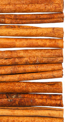 Cinnamon Sticks on White Background. Selective focus. Shallow DOF.
