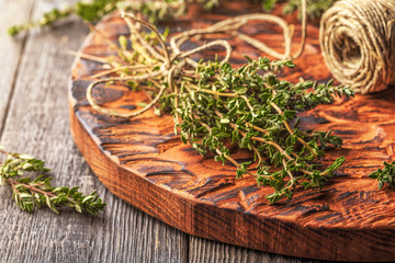 Thyme on old wooden board