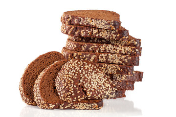 slices of black bread with sesame seeds isolated on white background