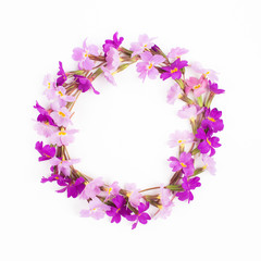 Fototapeta na wymiar Round frame made of lilac and purple flowers on white background. Flat lay, top view. Flowers frame wreath