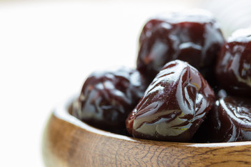 Dried plums on wood floor