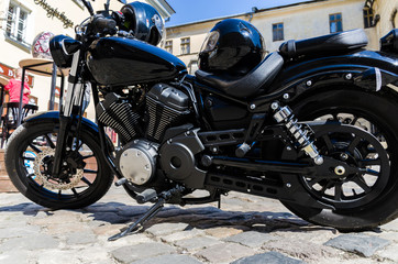 Fototapeta na wymiar Classic black motorcycle on the street