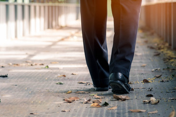 Close-up of back view business man elegant shoes walking