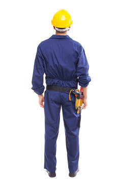Young worker standing from back on white background